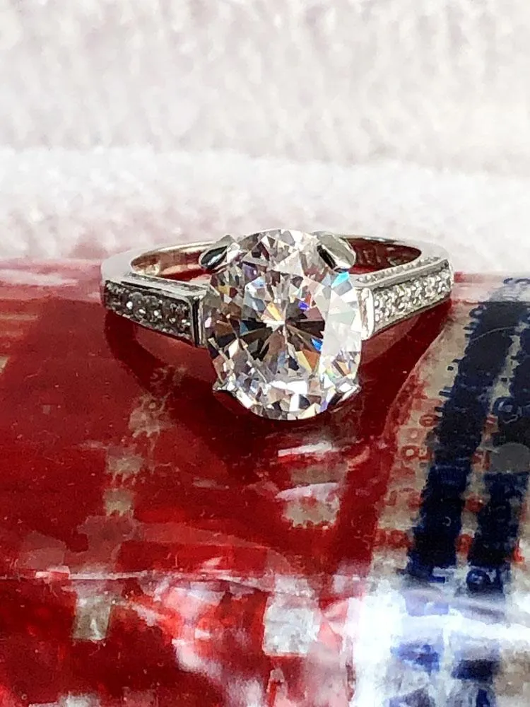 3.5 Carat Oval CZ Engagement Ring with pave set small side stones